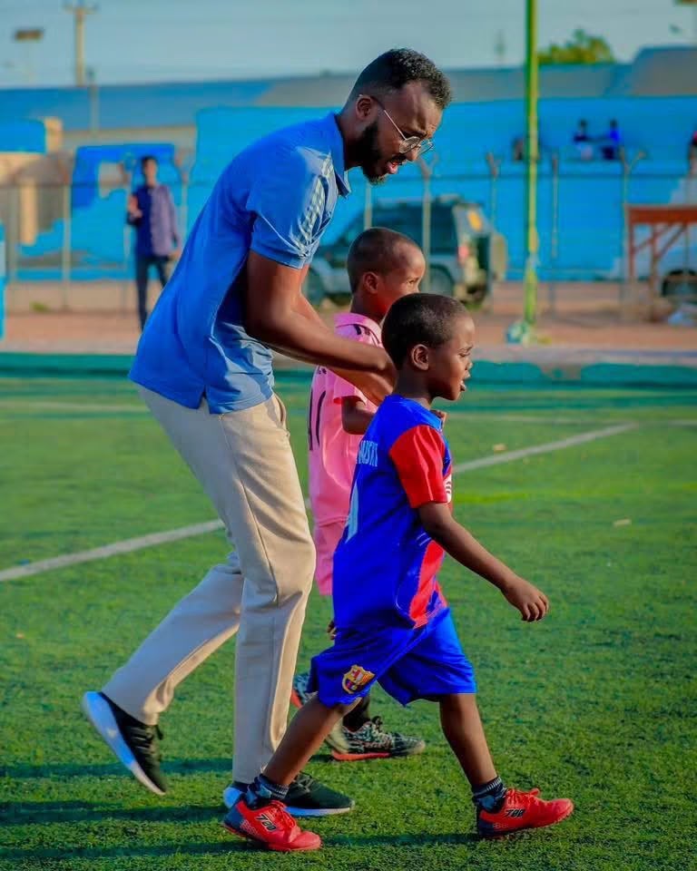 Youth football participants celebrating